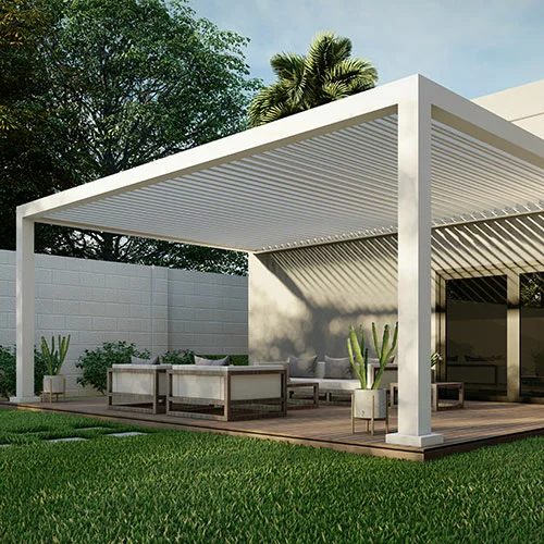 White R-Breeze pergola attached to the wall with fixed angled slats in a residential backyard - Azenco Outdoor